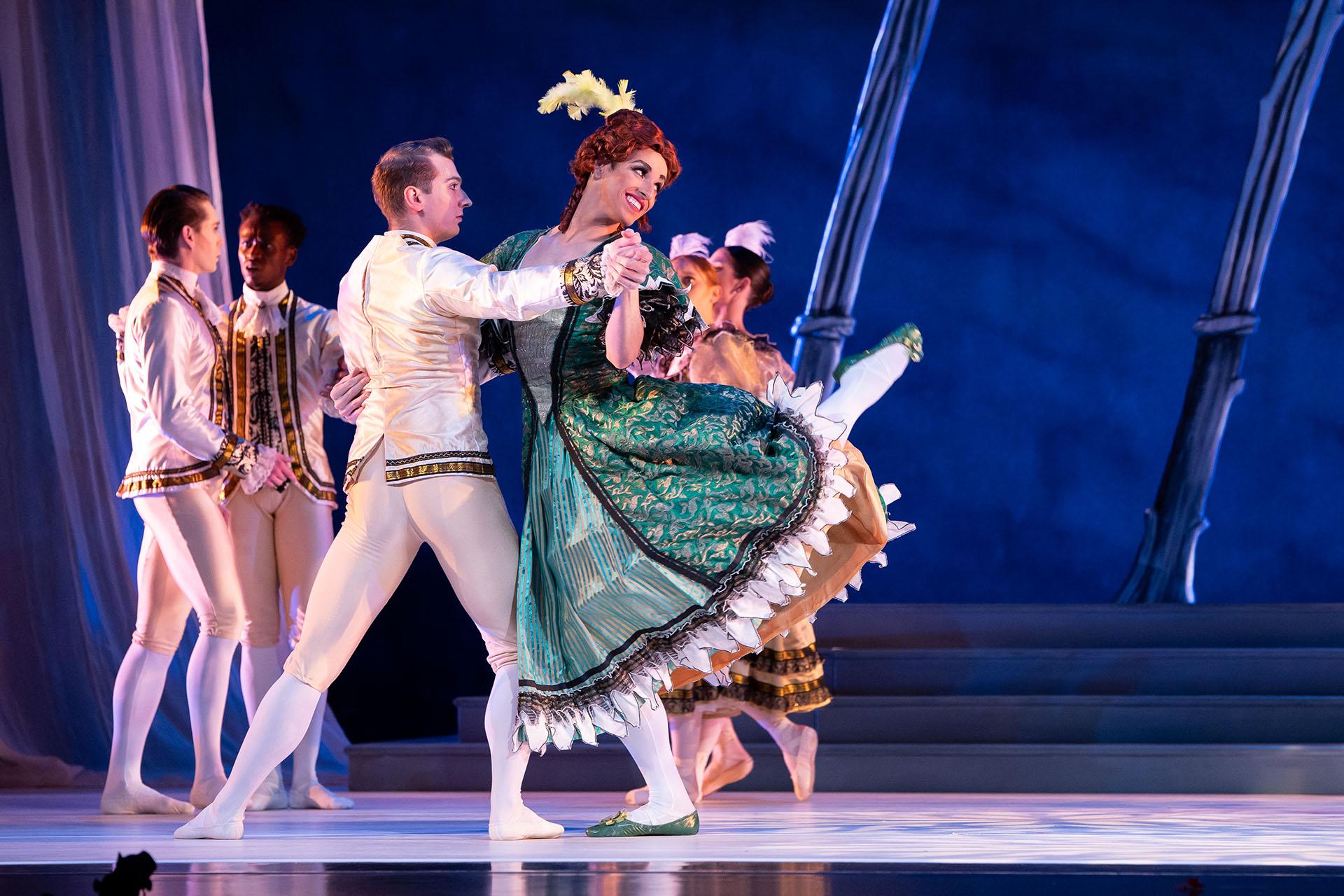 Sister in gaudy green dress dances uncouthly with an elegantly dressed man